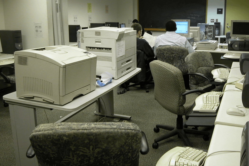 Two laserjet printers in a university computer lab.